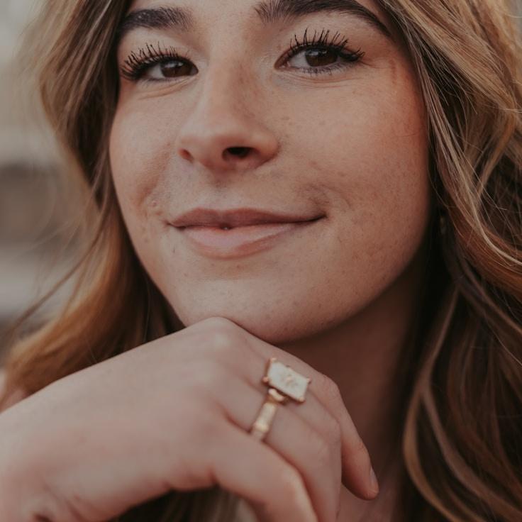 Alex Rivera, Lead Design Curator at OpenMindFramework, reviewing corporate floral arrangements